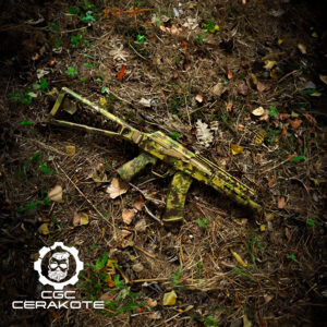 atacs camo cerakoted on an ak sitting on the ground