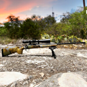bolt action rifle with a custom cerakote pattern